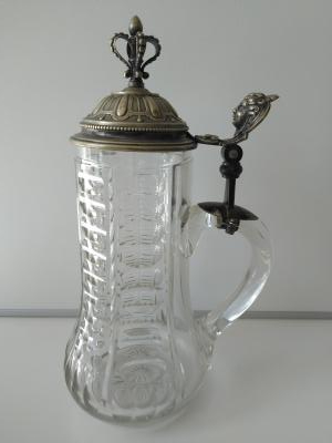 cut glass stein with ornate silvered lid