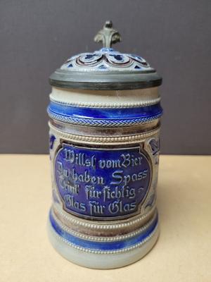 Beer stein with creamic inlaid lid